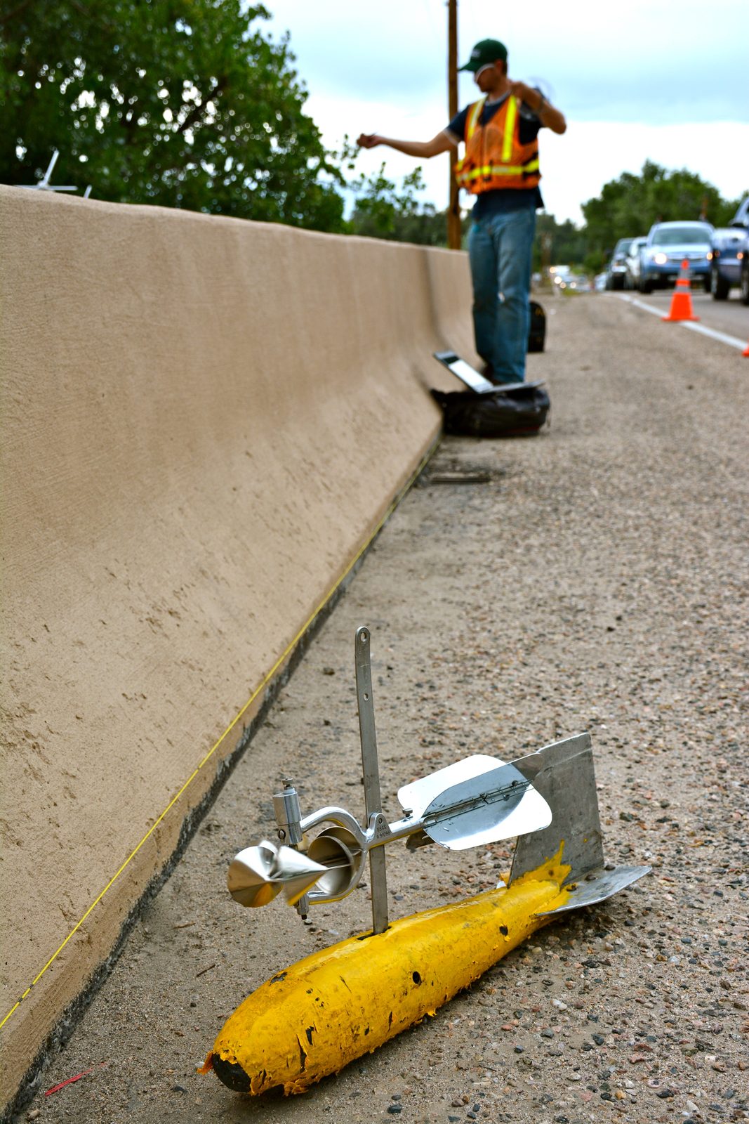 Someone working in Data — Ellis Abel Learns A USGS hydrologist stands in the flooded Big Thompson River collecting flood data with streamflow measuring equipment. Real USGS photograph used on the Ellis Abel Learns "Why I Love Data" page.