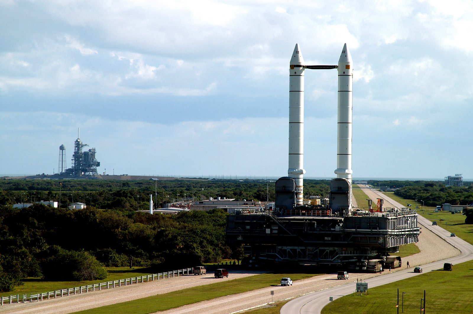 The tracked crawler-transporter carries a mobile launcher platform and twin solid rocket boosters along the crawlerway toward Launch Pad 39A. Real NASA photograph used on the Ellis Abel Learns "Why I Love Engineering" page.