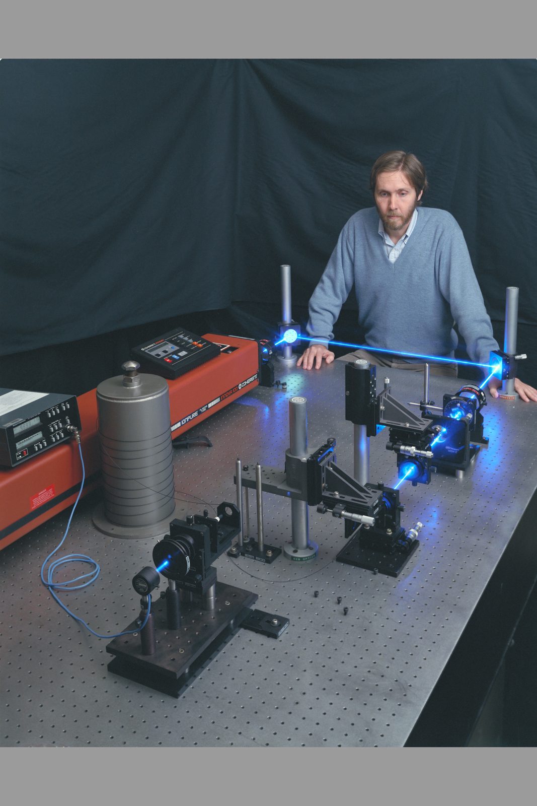 Someone working in Lasers — Ellis Abel Learns Researcher Dana Lynch works at the laser optics bench in the Laser Optics Laboratory at NASA Ames Research Center. Real NASA photograph used on the Ellis Abel Learns "Why I Love Lasers" page.