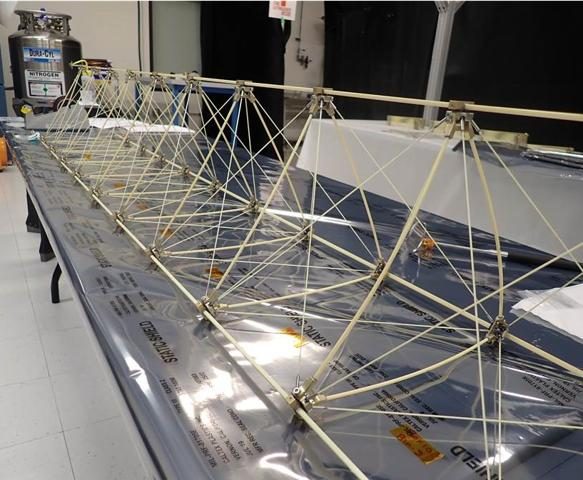 A test model of the long magnetometer boom for the Europa Clipper spacecraft laid out for checkout at the Jet Propulsion Laboratory. Real NASA photograph used on the Ellis Abel Learns "Why I Love Magnets" page.