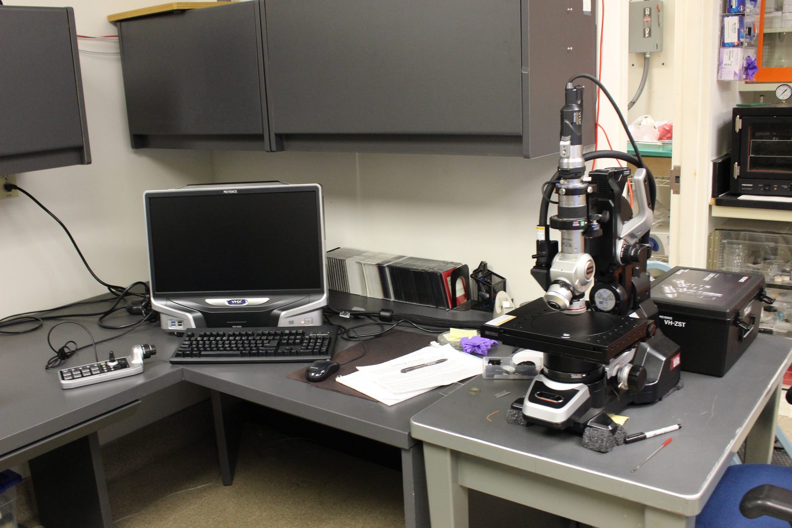 A Keyence optical microscope set up on a laboratory bench with its monitor and sample stage. Real USGS photograph used on the Ellis Abel Learns "Why I Love Microscopes" page.