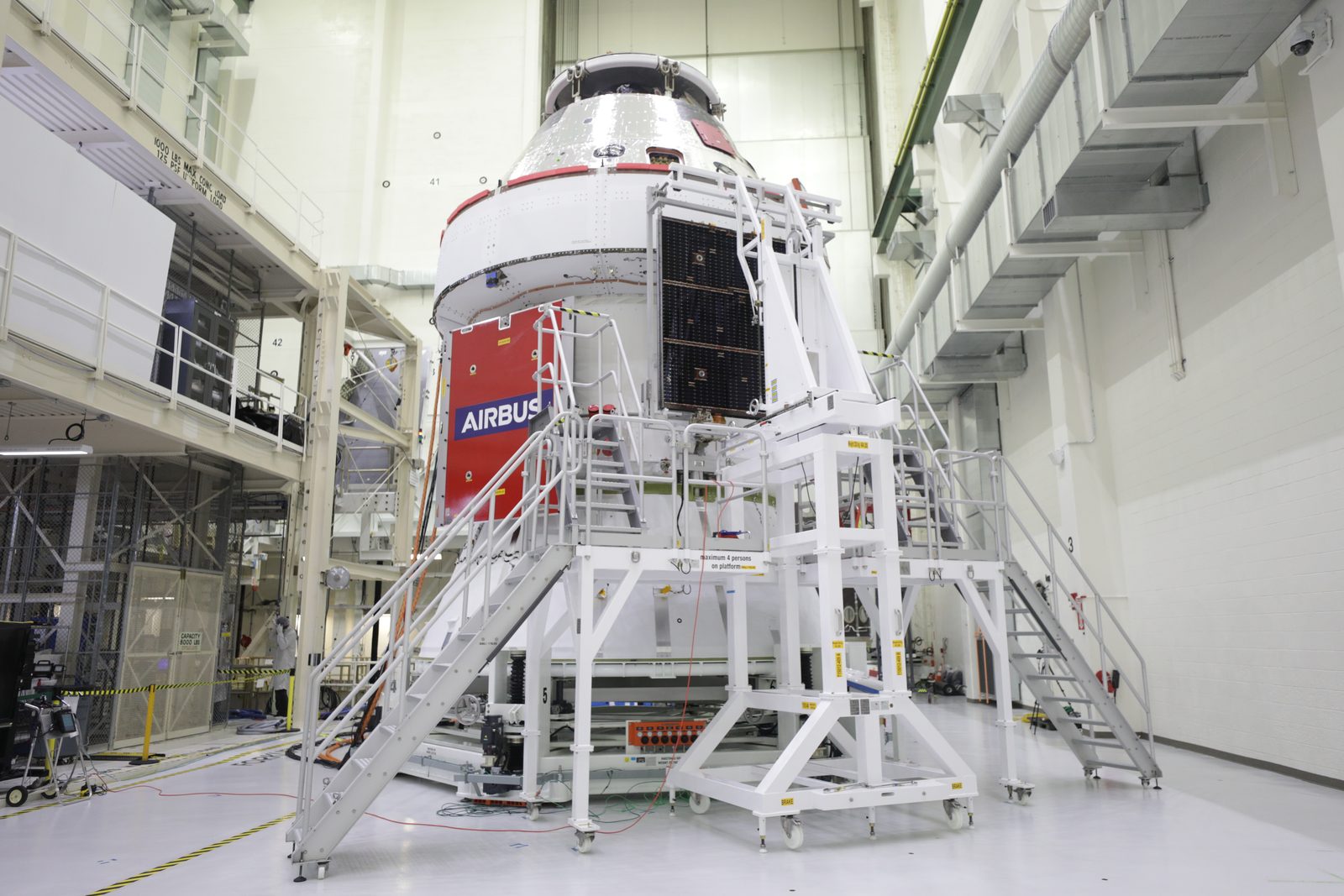 The last of four gold solar array wings is lowered into place on the Orion spacecraft's European Service Module. Real NASA photograph used on the Ellis Abel Learns "Why I Love Solar Power" page.