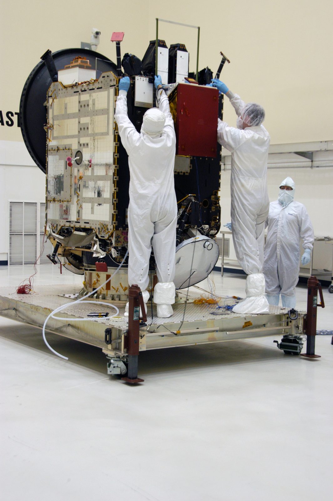 Someone working in Technology — Ellis Abel Learns Technicians in white clean-room 'bunny suits' begin work on the Dawn spacecraft inside a payload processing clean room. Real NASA photograph used on the Ellis Abel Learns "Why I Love Technology" page.