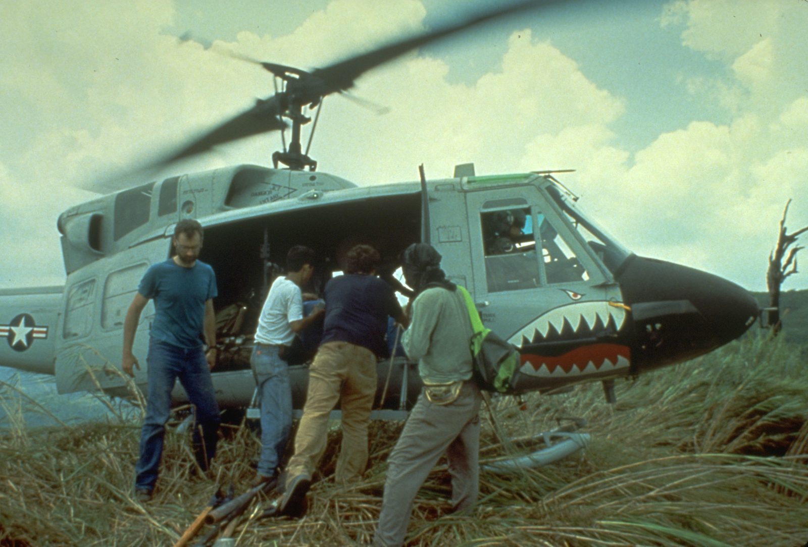 Someone working in Volcanoes — Ellis Abel Learns USGS and PHIVOLCS scientists load crates of volcano monitoring instruments into the back of a military helicopter before field work. Real USGS photograph used on the Ellis Abel Learns "Why I Love Volcanoes" page.