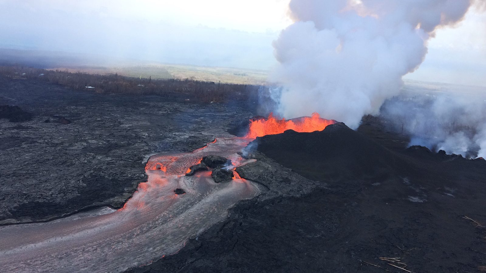 Three orange lava fountains jet more than 100 feet above the fissure 8 cone during the 2018 Kilauea eruption. Real USGS photograph used on the Ellis Abel Learns "Why I Love Volcanoes" page.